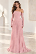 Graceprom blush pink chiffon prom dress with a strapless neckline, beaded sheer long sleeves, crossover hip ruching and flowing skirt.