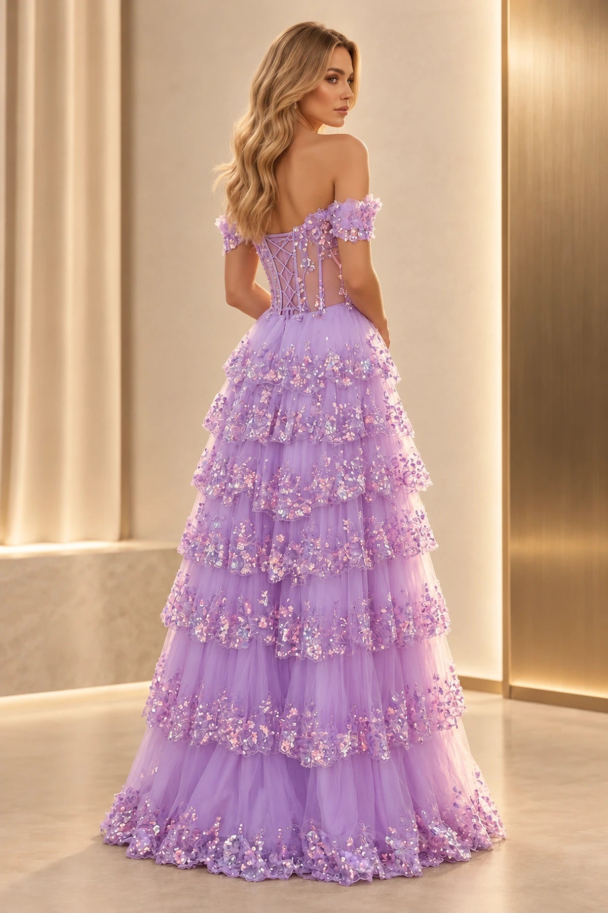 Back view of a lilac prom dress with a low lace-up corset back, sheer panels, off-shoulder sleeves, and sparkling tulle ruffle tiers.