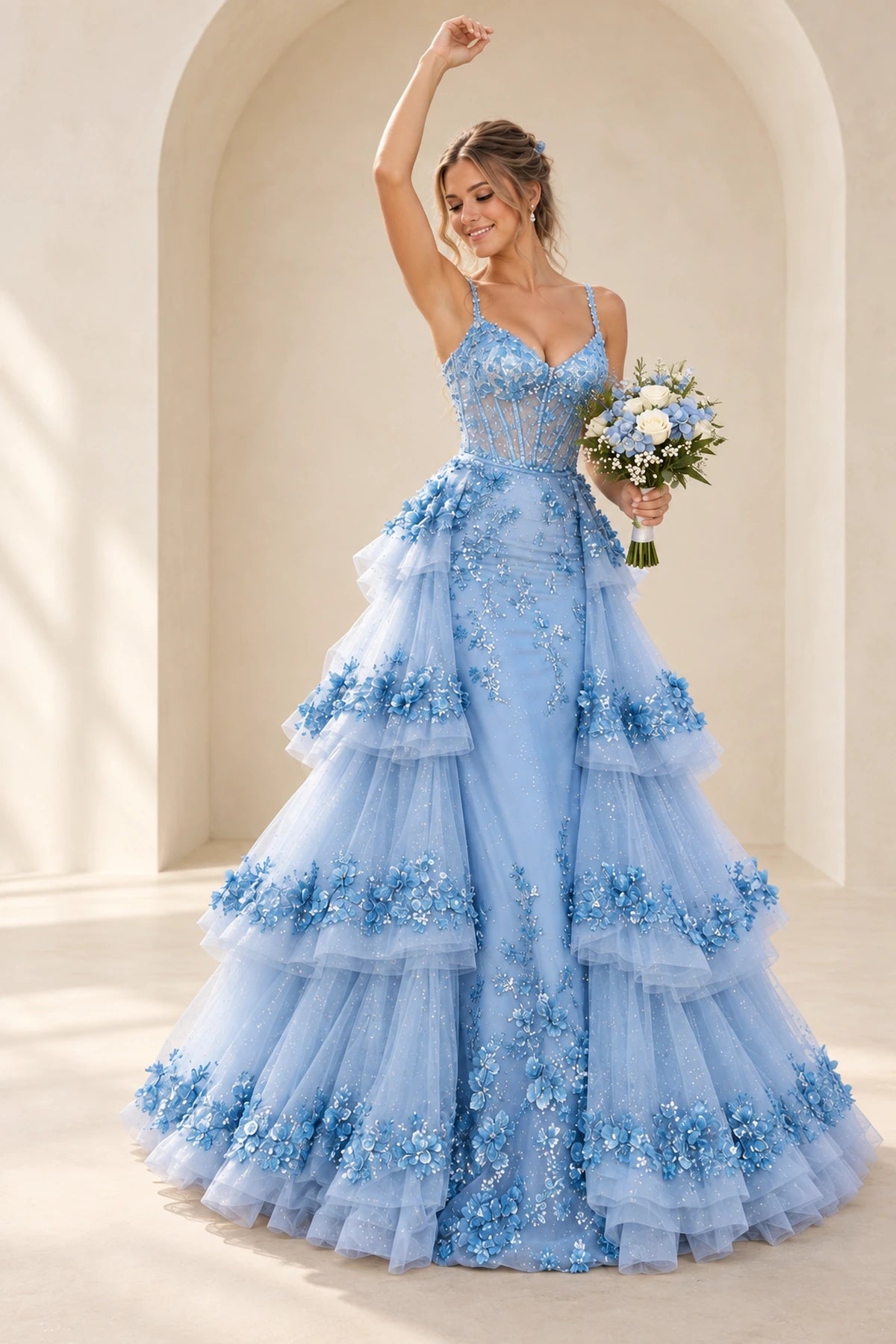 Light blue 3D floral tulle prom dress featuring a sweetheart neckline, sheer corset bodice, spaghetti straps, and a dramatic tiered floor-length A-line skirt.