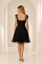 Black short homecoming Dress with lace up corset back and embroidered sleeves back view