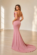 Back view of dusty rose mermaid wedding guest dress with low open back and sweeping train