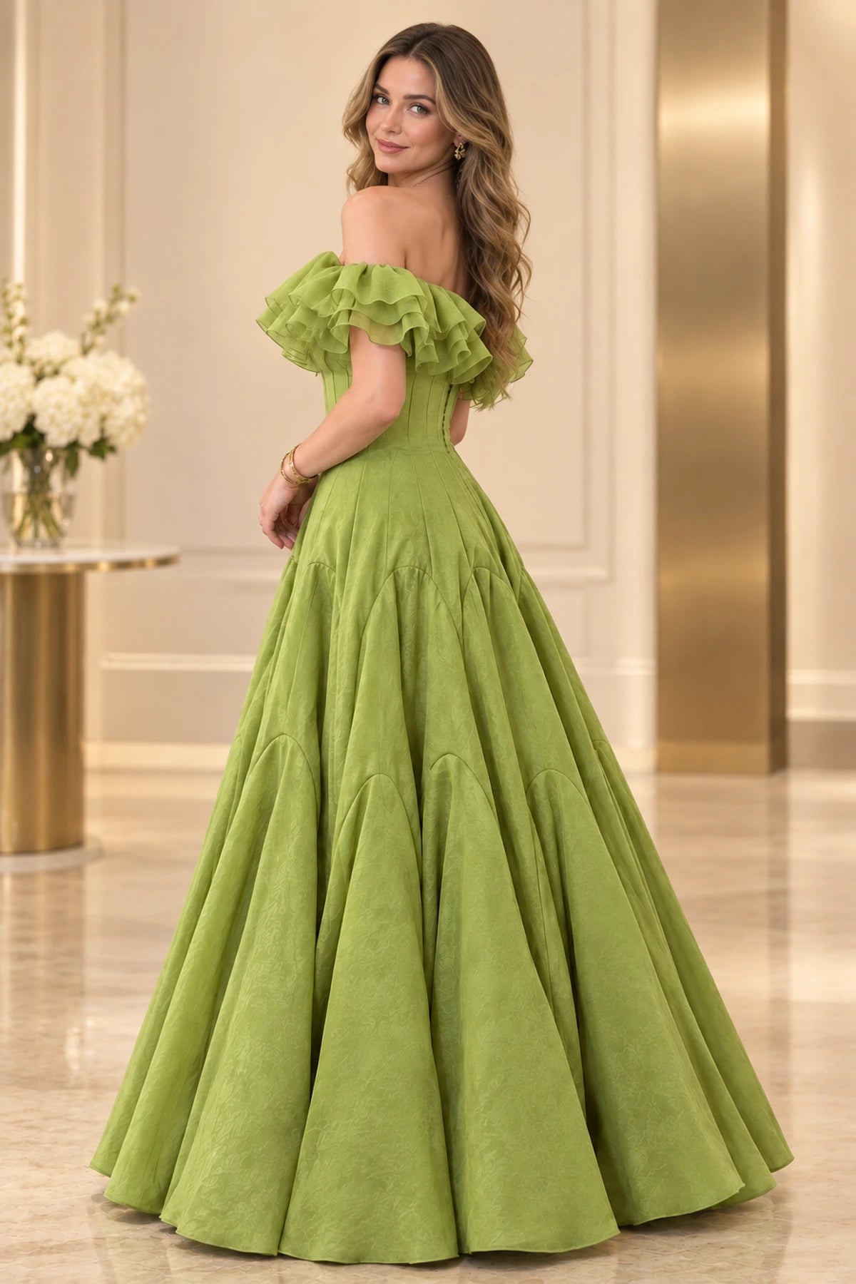 Side and partial back view of a sage green satin prom gown with romantic off-the-shoulder ruffles, fitted waist, and voluminous A-line skirt.