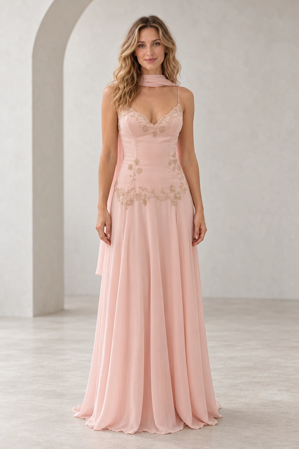 Blush pink beaded chiffon A-line wedding guest dress with V neckline, spaghetti straps, floral lace bodice, draped scarf detail and floor length skirt by Graceprom