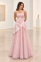 Blush pink satin and tulle A-line prom dress with strapless neckline, floral beaded bodice, asymmetrical draped waist and floor length skirt by Graceprom