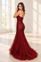 Back view of Graceprom burgundy halter prom dress with an open back, curved beadwork and a layered tulle mermaid skirt with sweeping train.