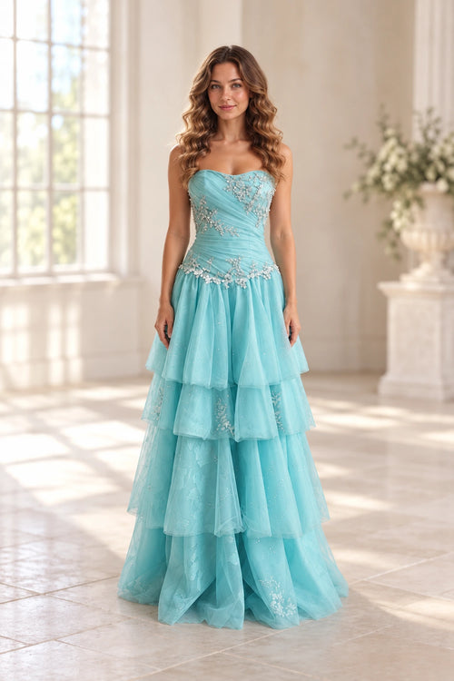 Aqua blue beaded tulle A-line prom dress with strapless sweetheart neckline, ruched bodice, floral appliques and layered tiered floor length skirt by Graceprom