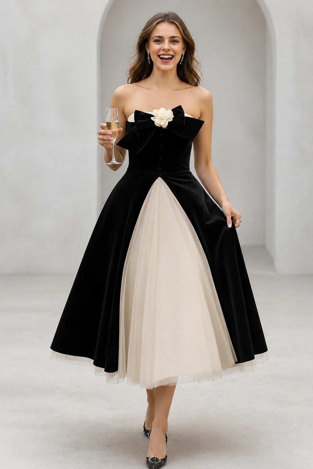 Black and ivory strapless A-line tea length wedding guest dress with bow detail by GraceProm