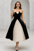 Black and ivory strapless A-line tea length wedding guest dress with bow detail by GraceProm