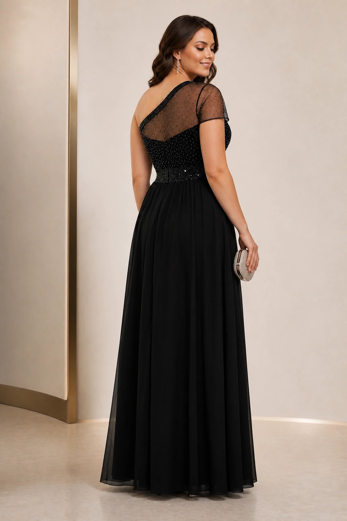 Black formal evening dress with beaded bodice and elegant back design