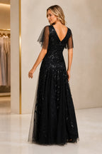 Black sequin mother of the bride dress with V-back and sheer flutter sleeves