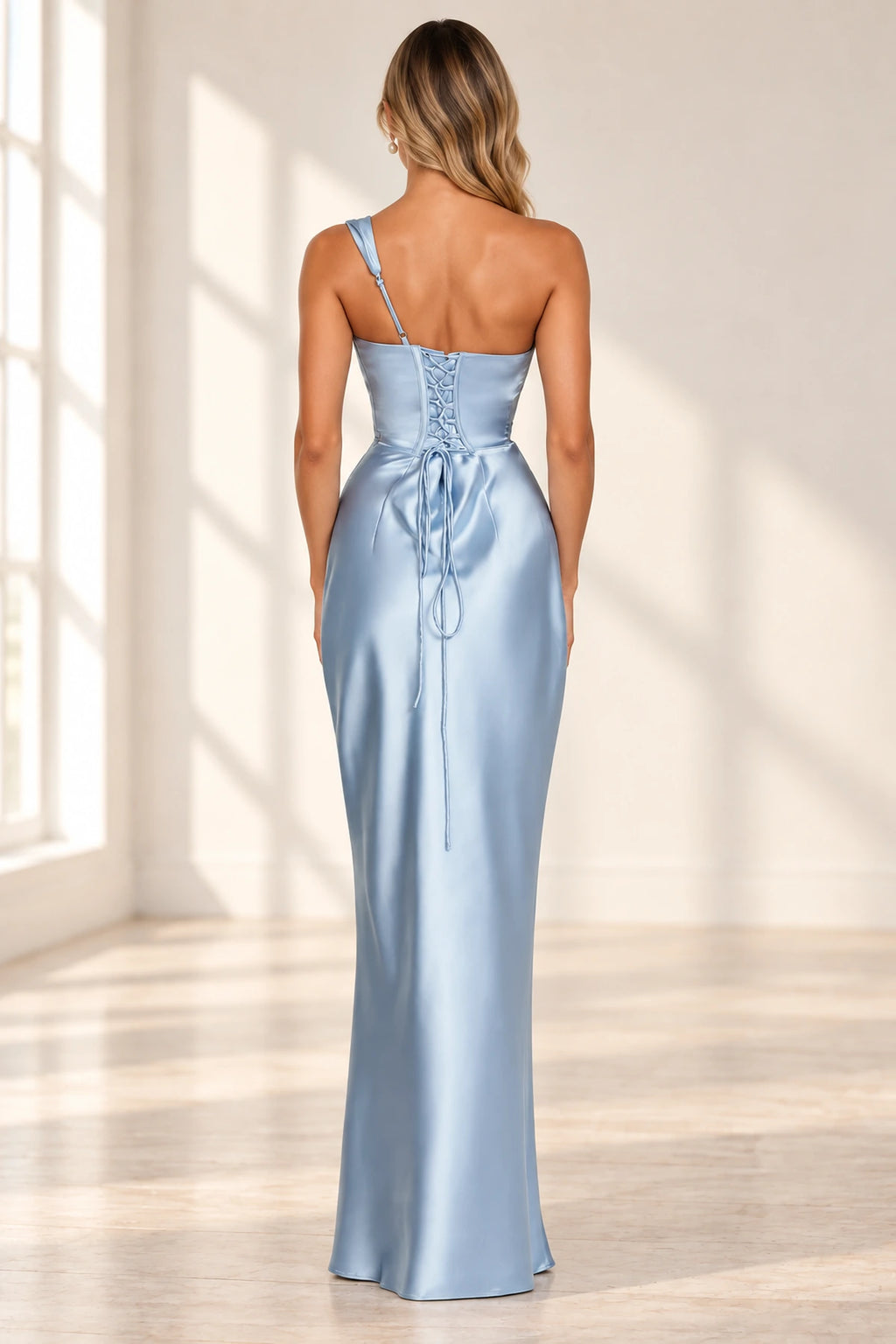Corset lace up back detail of blue satin formal wedding guest gown