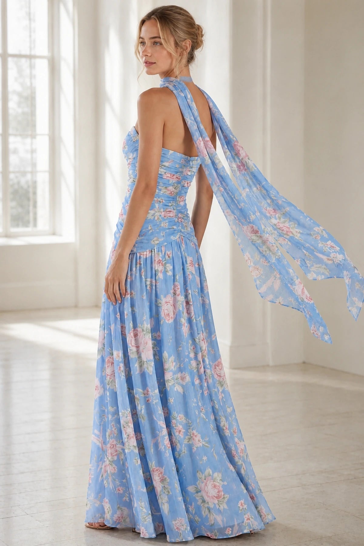 Blue floral open-back floor-length wedding guest dress with flowing scarf back view