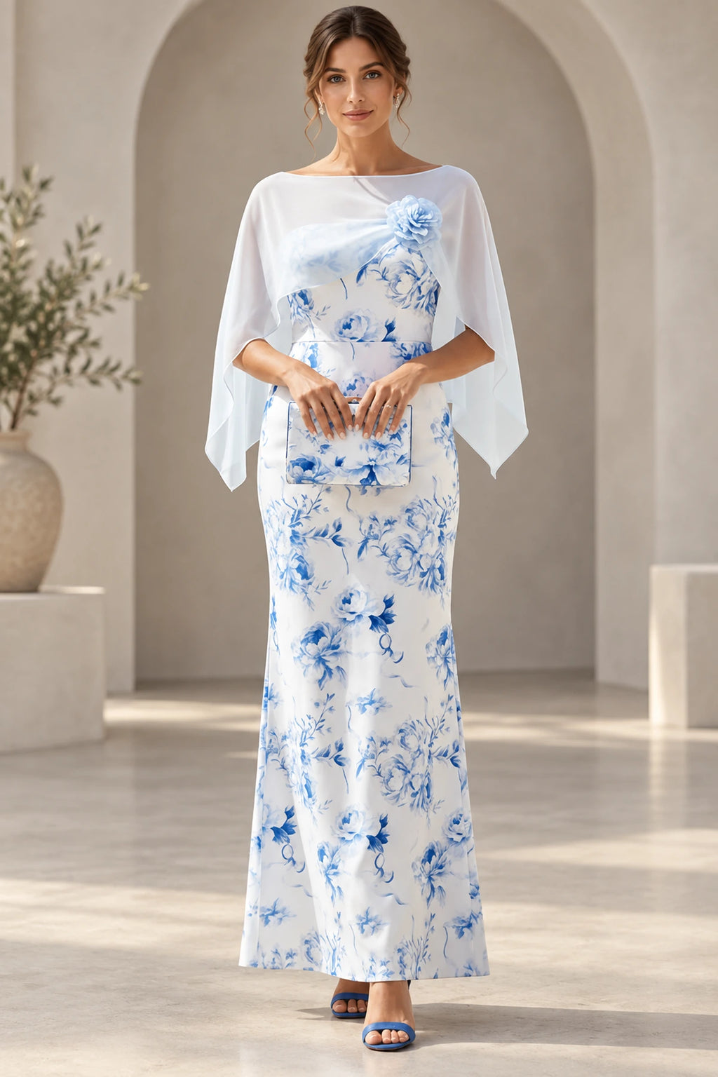 Blue and white floral Mother of the Bride Dress with bateau neckline, cape sleeves and flower shoulder detail