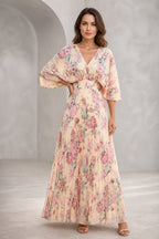 Blush floral mother of the bride dress with V-neckline, flutter sleeves, defined waist and flowing floor-length A-line skirt
