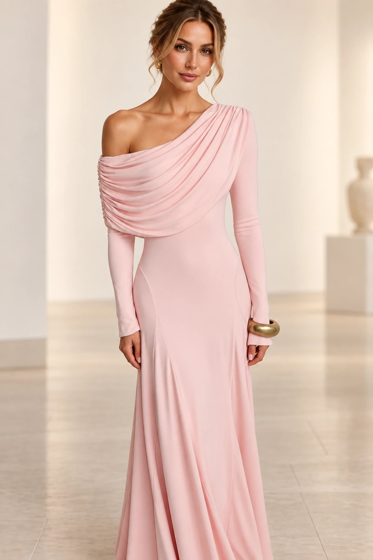 Back view of blush bridesmaid dress with asymmetric shoulder and draped back detail by Graceprom