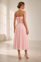 Blush pink strapless 3D floral midi wedding guest dress back view