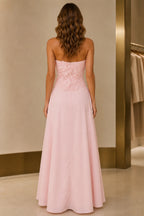Blush pink strapless floor-length prom dress with floral appliques and zip back