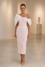 Blush pink sheath midi wedding guest dress with white statement bow sleeves by GraceProm