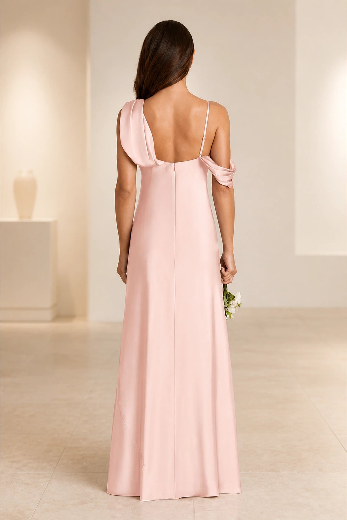 Blush pink bridesmaid dress with asymmetric draped neckline, sleeveless design, open back and floor-length column silhouette, front and back view