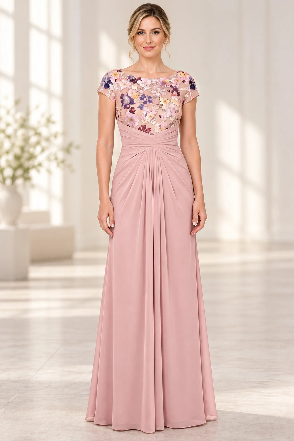Blush pink Mother of the Bride Dress with floral embroidered bodice, bateau neckline, cap sleeves and ruched floor length skirt