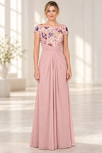 Blush pink Mother of the Bride Dress with floral embroidered bodice, bateau neckline, cap sleeves and ruched floor length skirt