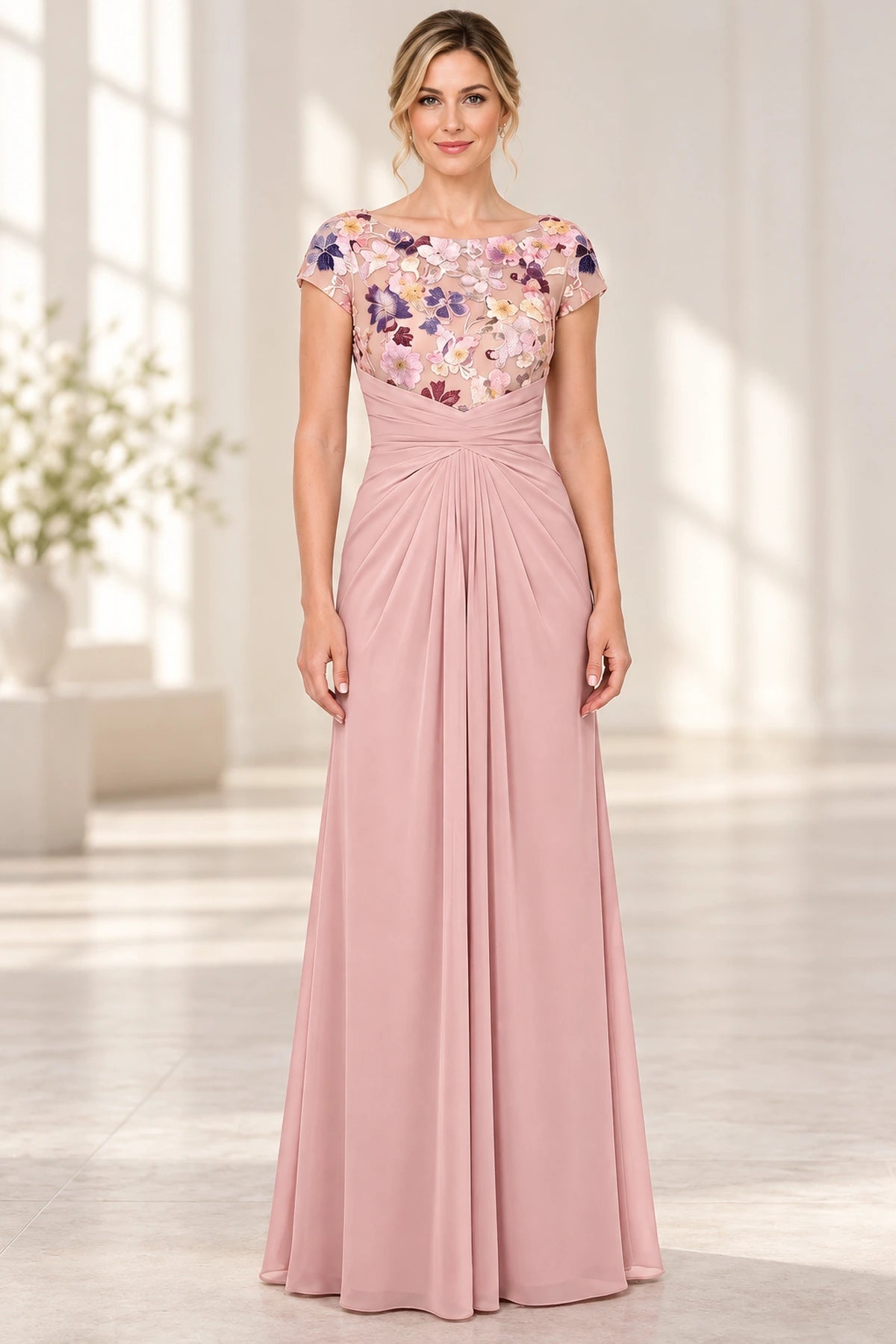 Blush pink Mother of the Bride Dress with floral embroidered bodice, bateau neckline, cap sleeves and ruched floor length skirt