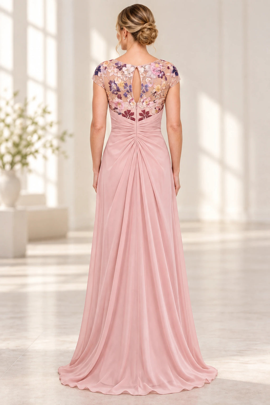 Blush pink Mother of the Bride Dress with floral illusion keyhole back, cap sleeves and softly gathered floor length skirt