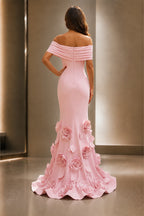 Back view of blush pink wedding guest dress with off-shoulder neckline, center zipper and floral mermaid floor-length skirt