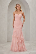 Blush pink strapless sweetheart mermaid wedding guest dress with ruched bodice and floral applique floor-length skirt