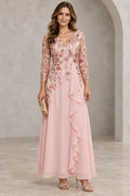Blush pink Mother of the Bride Dress with floral embroidered V neckline, three quarter illusion sleeves and draped floor length skirt