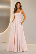 Blush pink A-line bridesmaid dress with square neckline, wide straps, floral jacquard texture and floor-length skirt