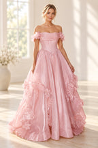 Blush pink A line prom dress with a pleated off shoulder neckline, floral arm details, pointed corset-style waist, and flower-trimmed skirt.