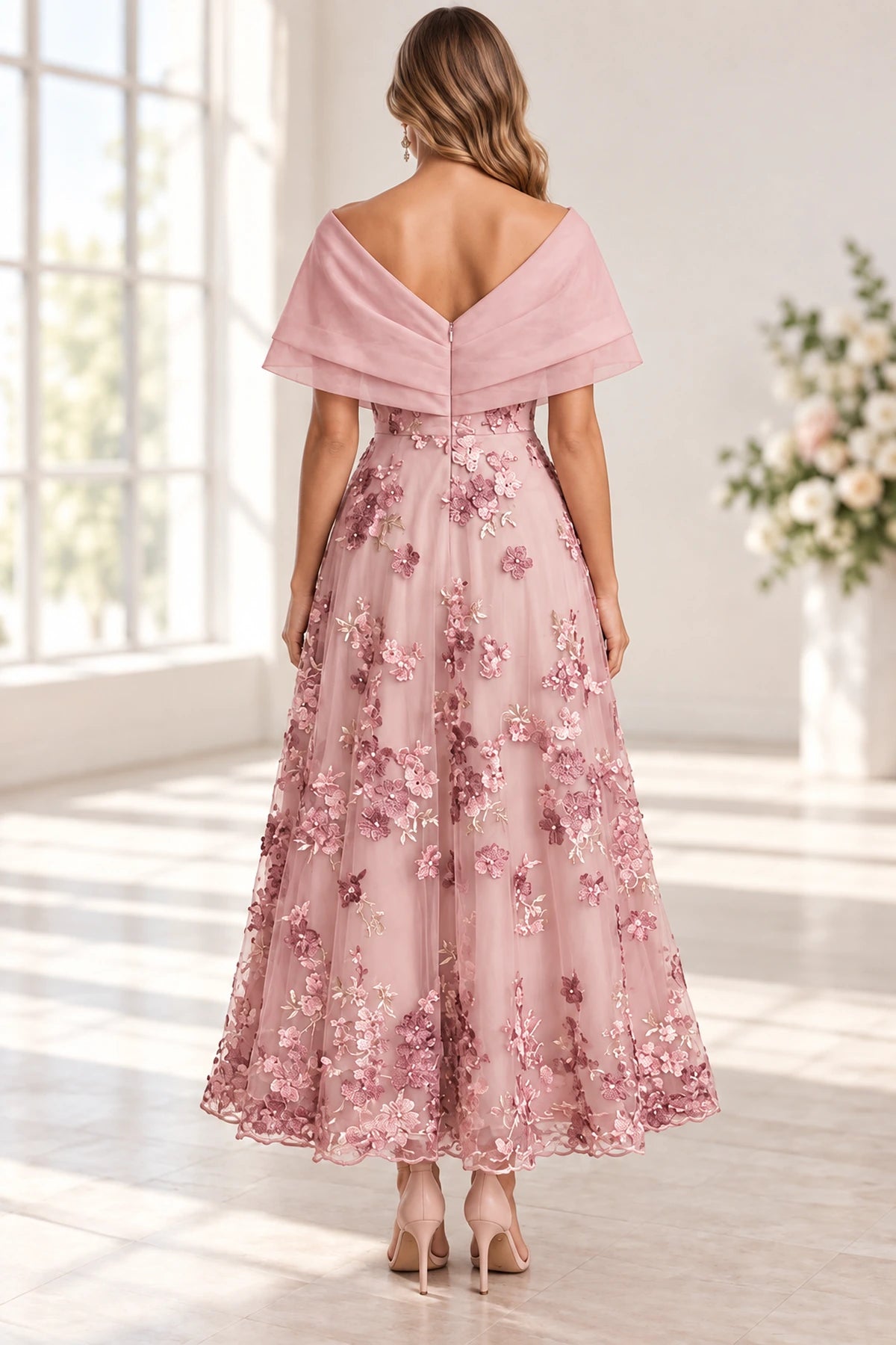Blush pink Mother of the Bride Dress with V-back, zipper closure and floral appliqué skirt