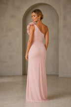 Back view of blush pink fitted prom dress with asymmetric shoulder and zipper closure