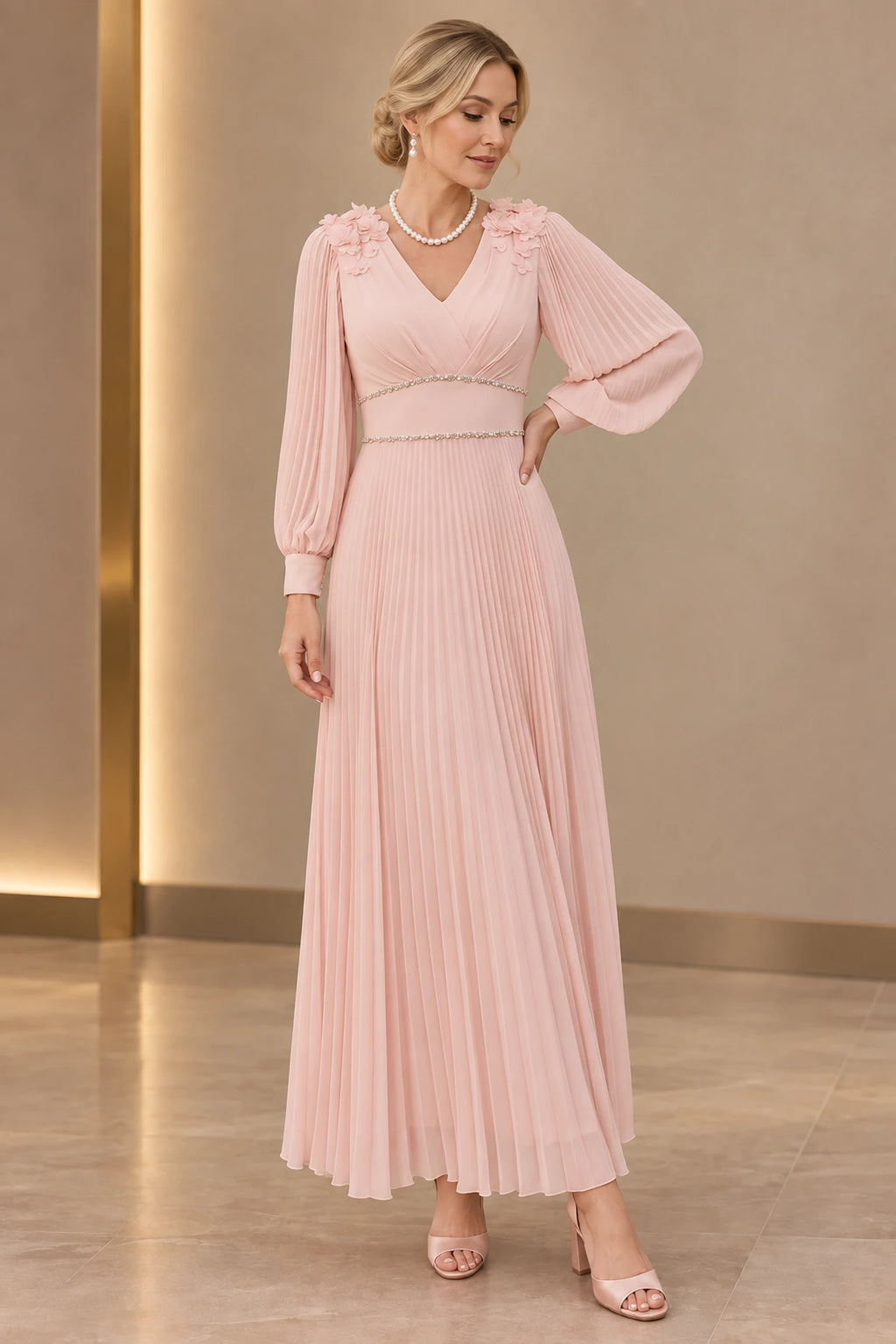 Blush pink A-line Mother of the Bride Dress with V-neck, long pleated sleeves, floral shoulder appliqués and pleated skirt