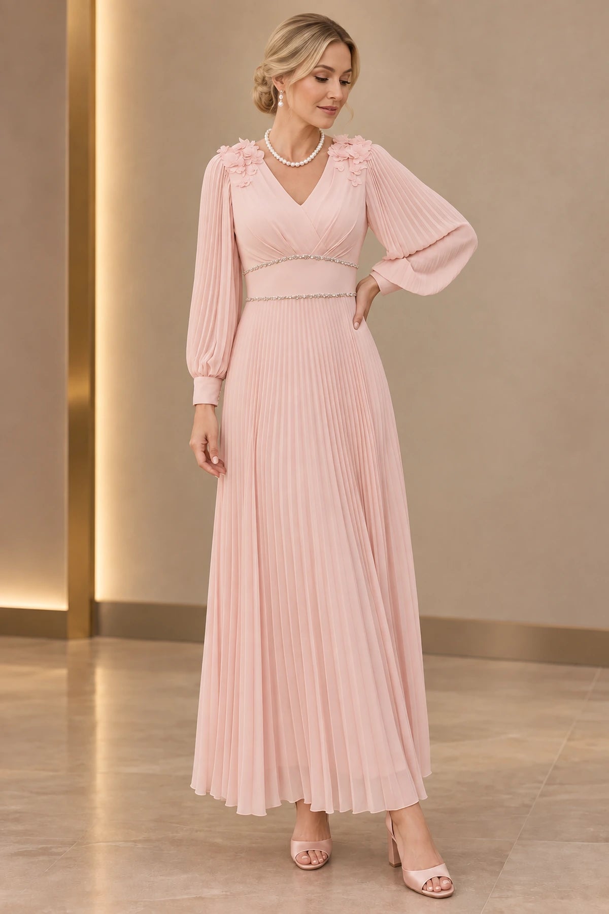 Blush pink A-line Mother of the Bride Dress with V-neck, long pleated sleeves, floral shoulder appliqués and pleated skirt