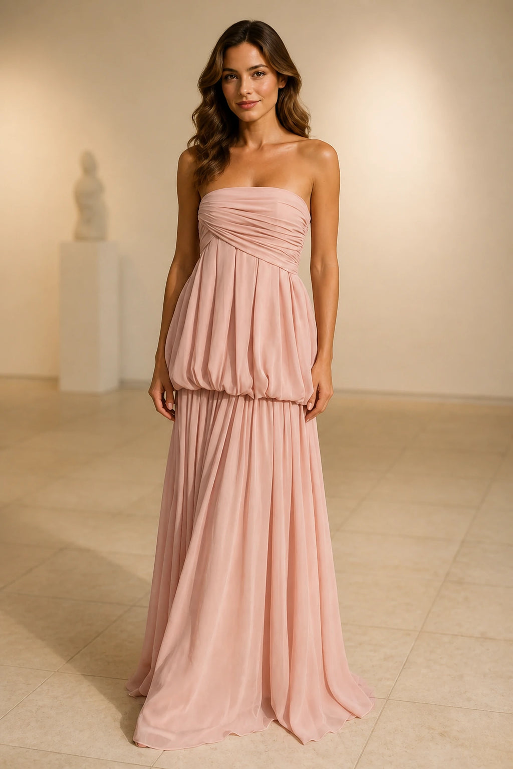 Blush pink strapless ruched A-line long bridesmaid dress with pleated skirt