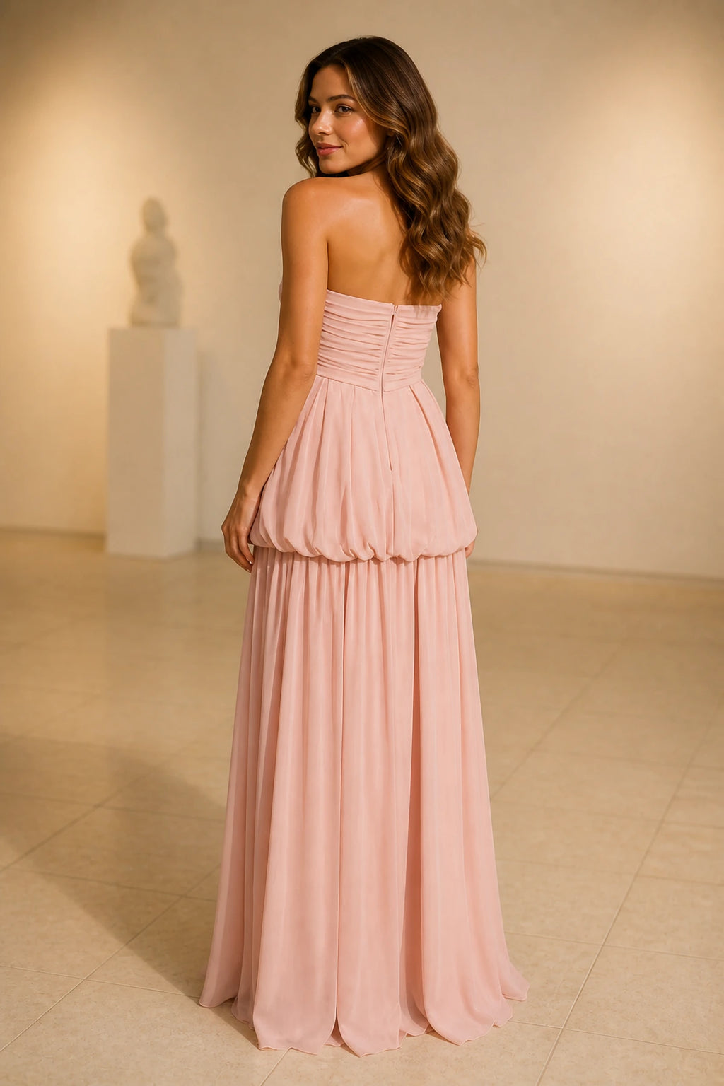 Blush pink strapless ruched A-line long bridesmaid dress with pleated skirt