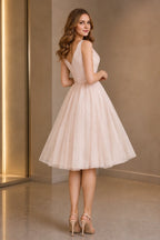 Back view of GraceProm blush pink V-back tulle wedding guest dress