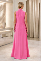 Back view of bright pink wedding guest dress with high neckline, sleeveless closed back, center zipper and floor-length A-line skirt