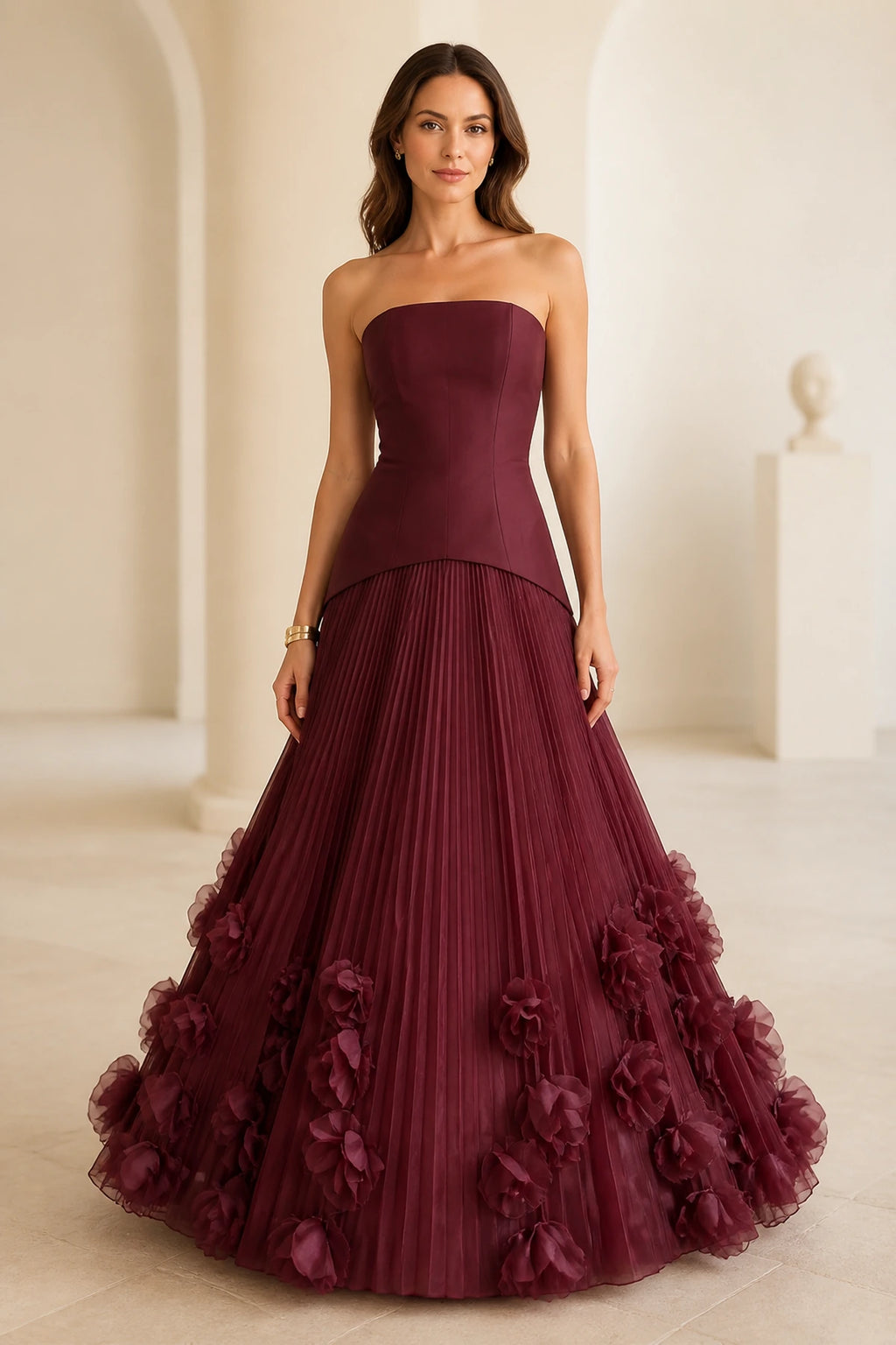 Burgundy strapless floor-length wedding guest ball gown with pleated skirt and 3D floral appliques