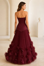 Burgundy strapless wedding guest ball gown with zip back and 3D floral skirt details