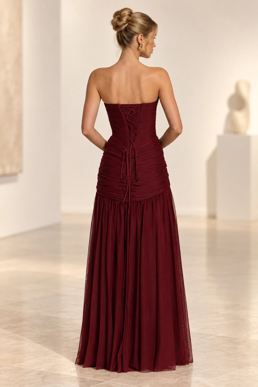 Burgundy lace up back wedding guest dress with ruched bodice detail