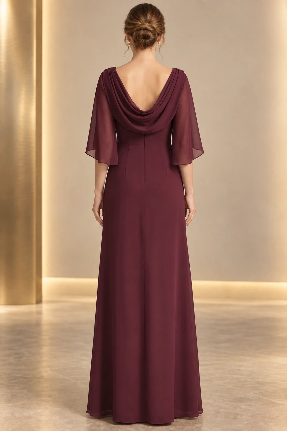 Burgundy mother of the bride dress with draped cowl back cape sleeves and floor length skirt