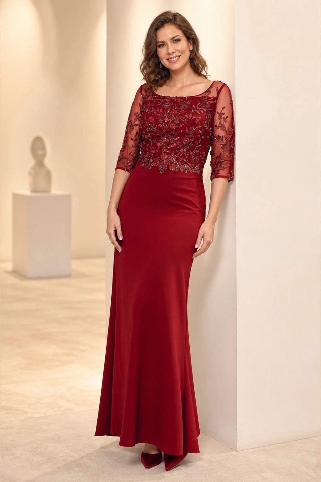 Front view of Vedress burgundy mermaid mother of the bride dress with bateau neckline, illusion embroidered bodice, 3/4 sleeves and floor length skirt