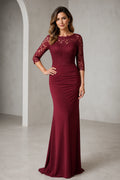Front view of Vedress burgundy mermaid mother of the bride dress with illusion lace bodice, three quarter sleeves, ruched waist and floor length skirt
