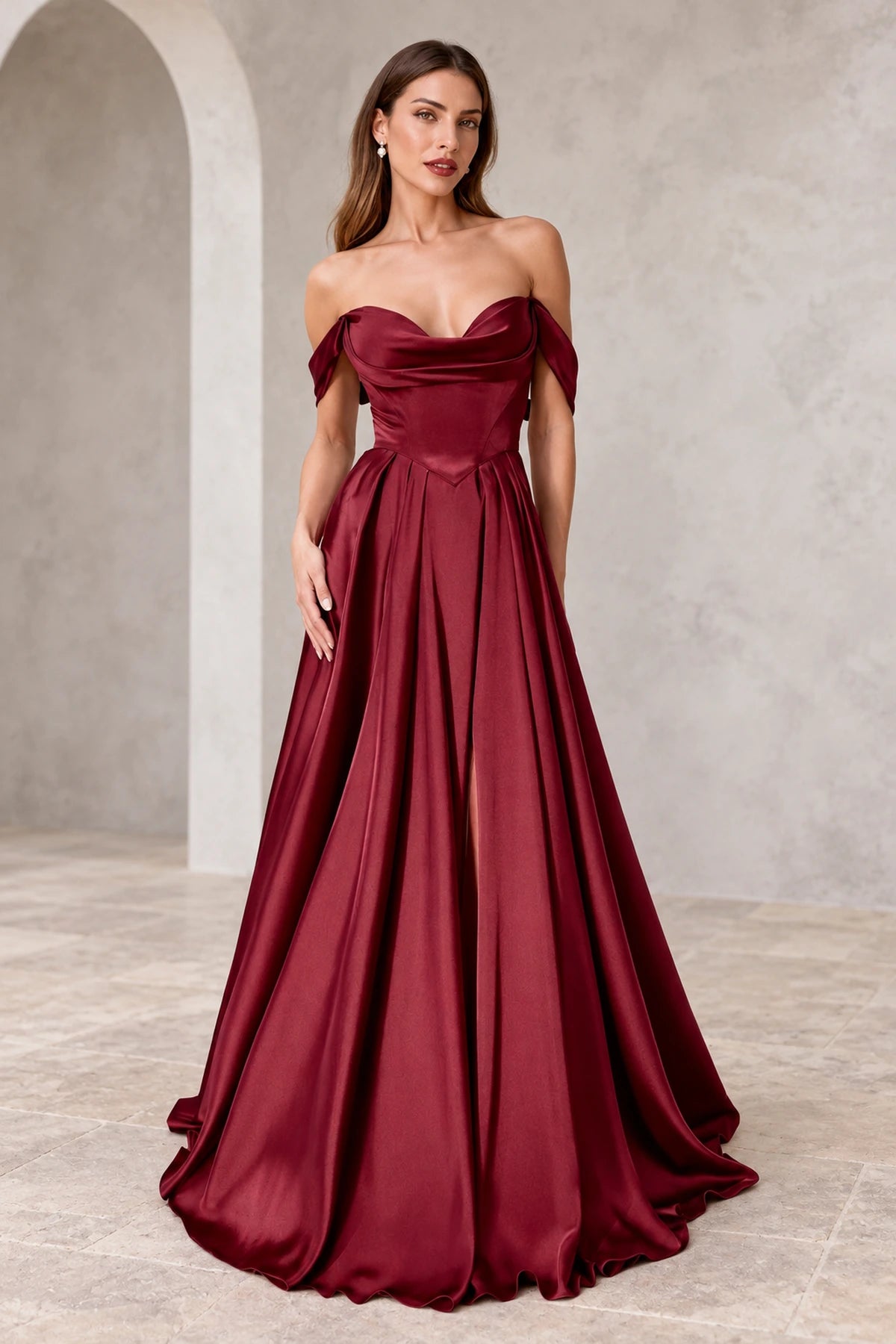 Burgundy A-line prom dress with draped sweetheart neckline, off-the-shoulder sleeves, pointed waist, and flowing satin-look skirt with front slit by Graceprom.