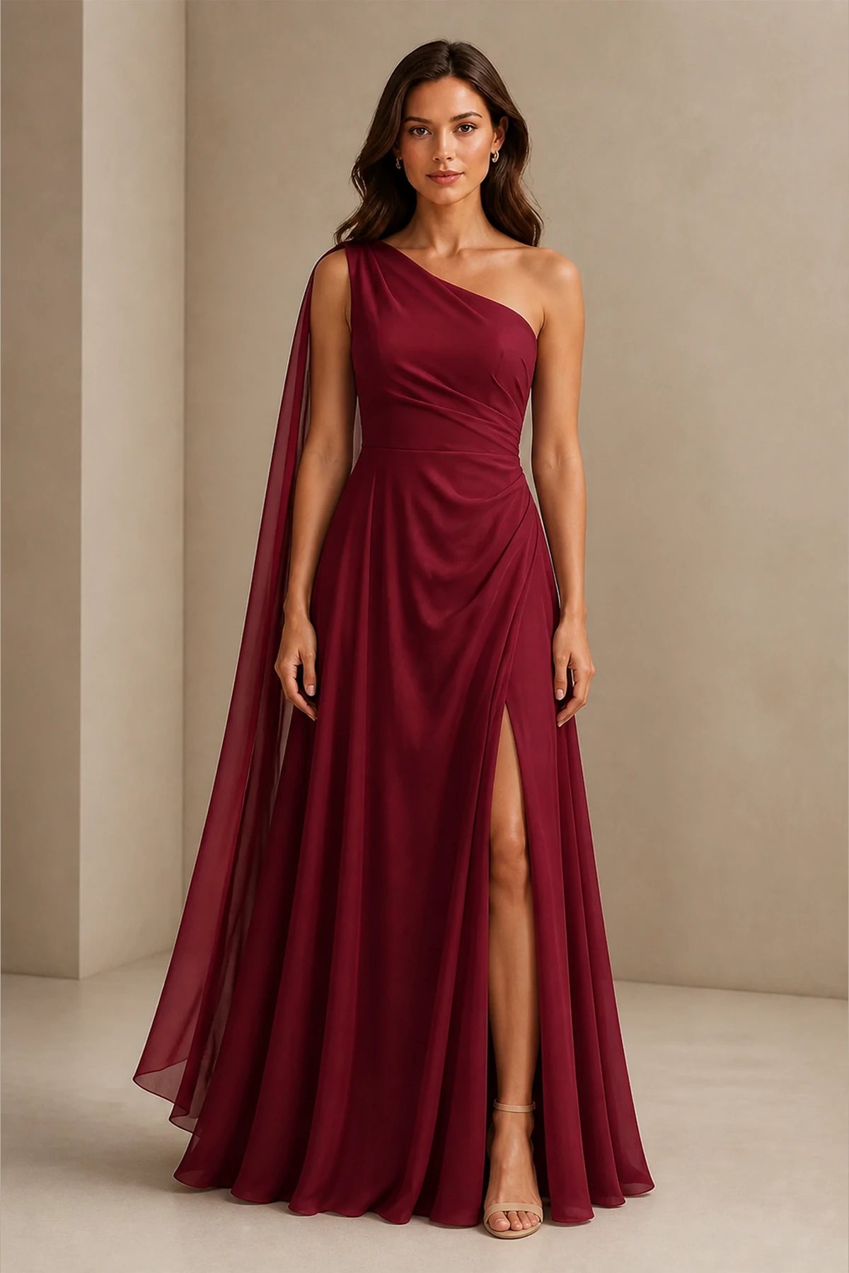 Burgundy one shoulder prom dress with flowing chiffon cape, ruched waist, high side slit and floor length A-line silhouette, front and back view