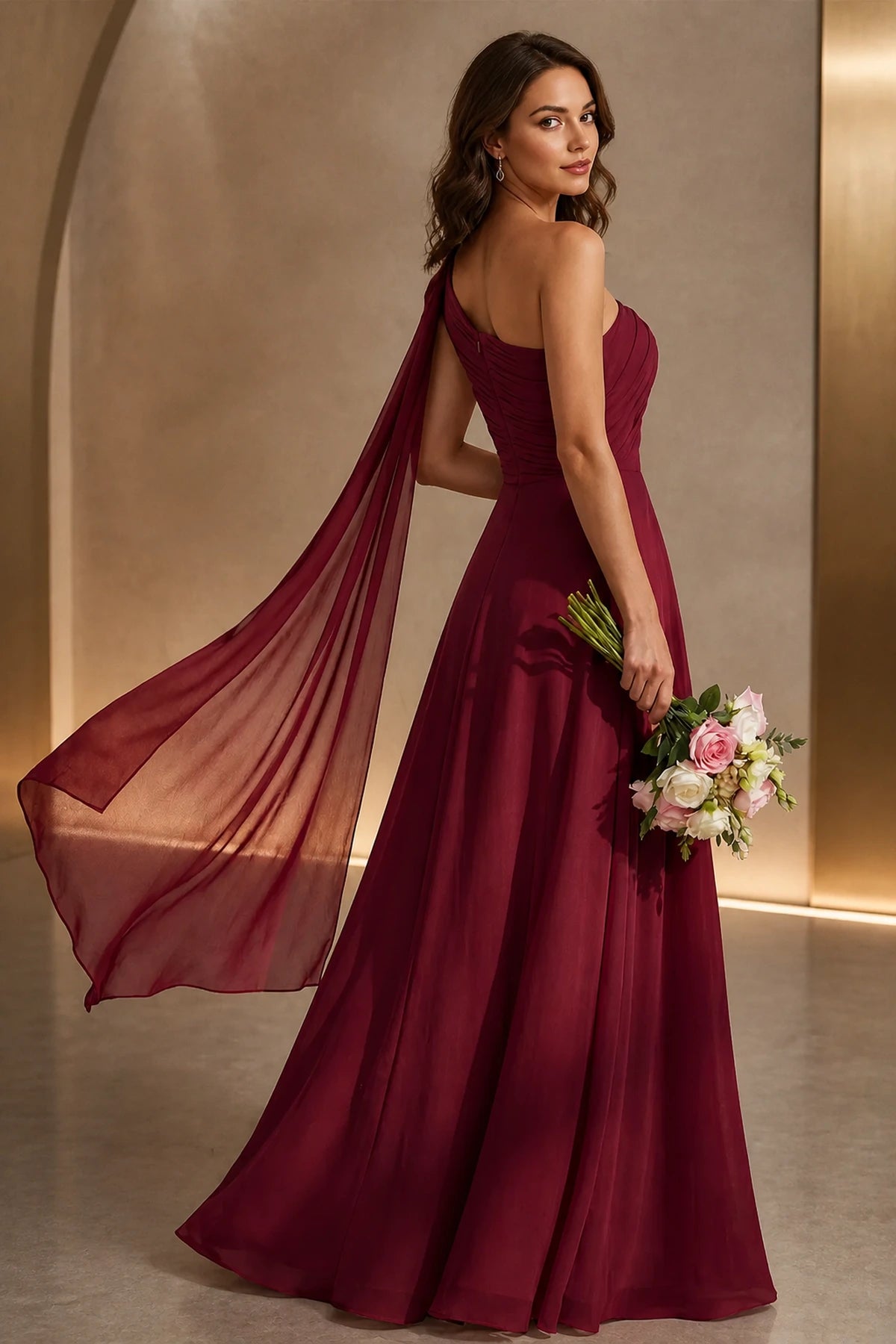 Burgundy one shoulder prom dress with flowing chiffon cape, ruched waist, high side slit and floor length A-line silhouette, front and back view