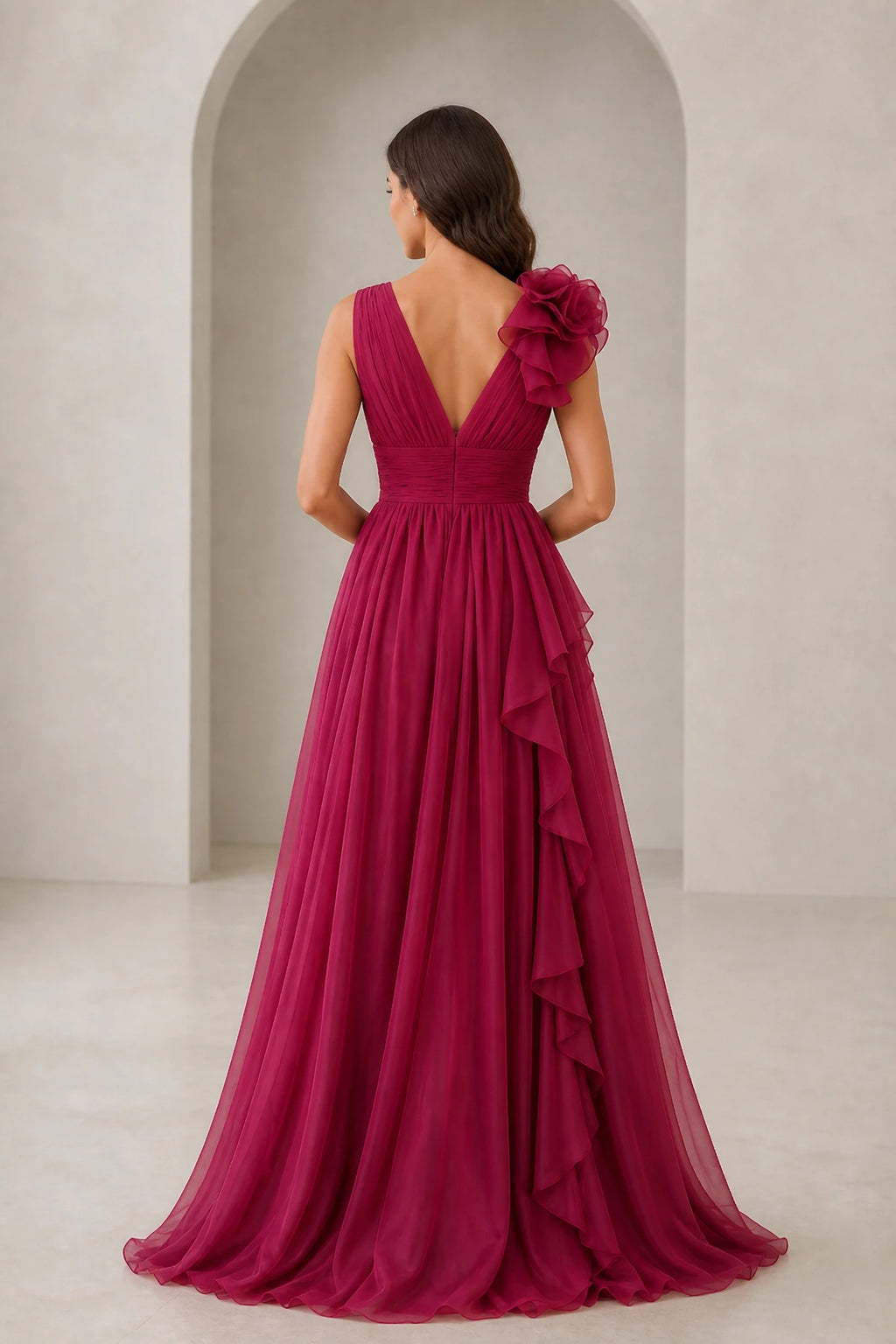 Burgundy bridesmaid dress with V-back, shoulder ruffle, and flowing floor-length skirt